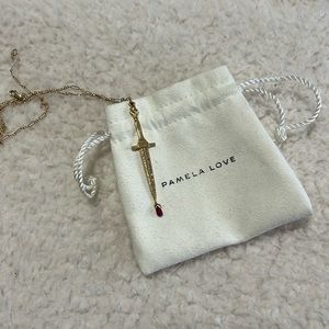 Pamela Love fine jewelry Dagger pendant with diamonds and ruby